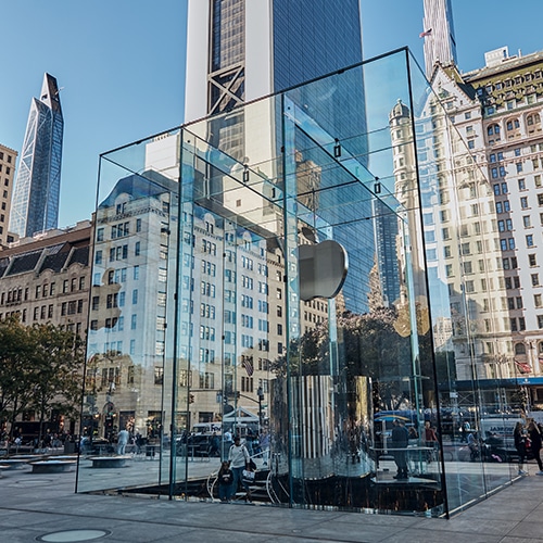 A glass subway entrance with an Apple.inc logo in New York City
