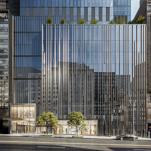 Street view of a beautifully designed office building off of 57th