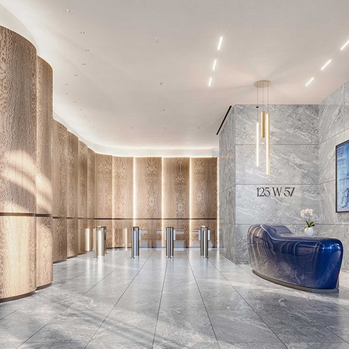An elegant office building lobby with a blue stone front desk