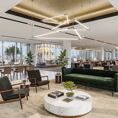 A gorgeous urban office with dark green sofas and leather chairs